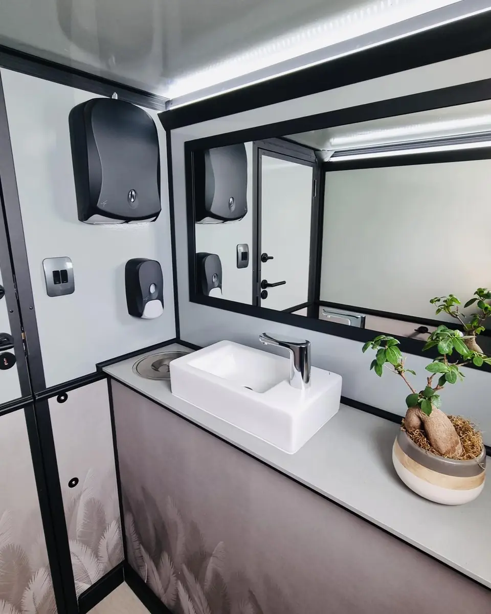Restroom trailer vanity with vessel sink and mirror